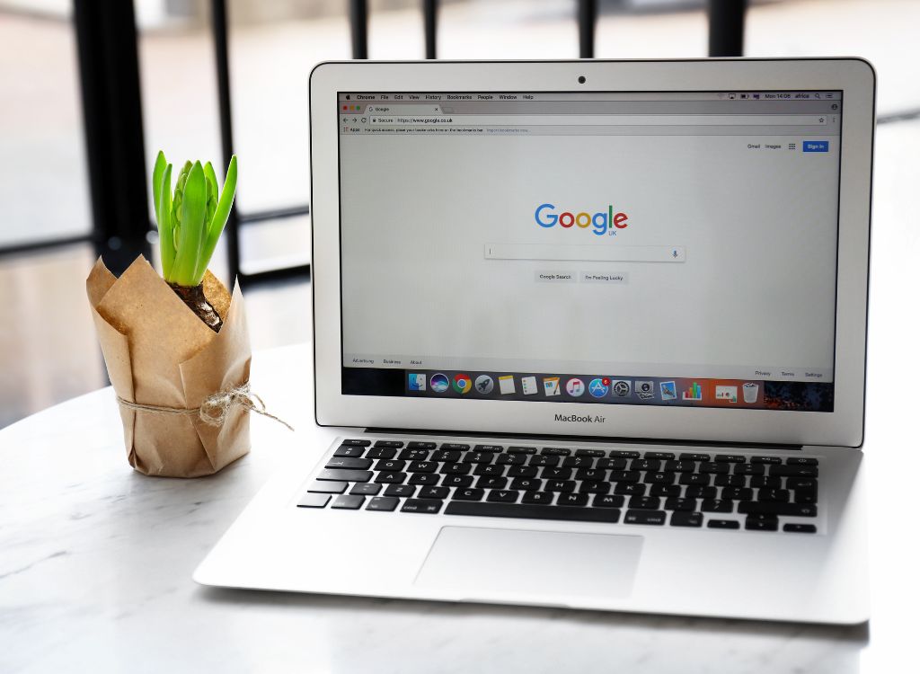 Image of a laptop displaying Google search